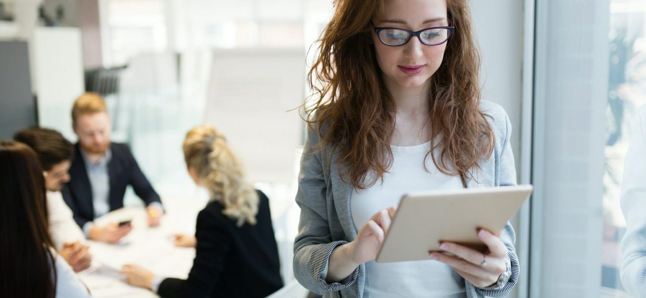 Elegant smart businesswoman in company office